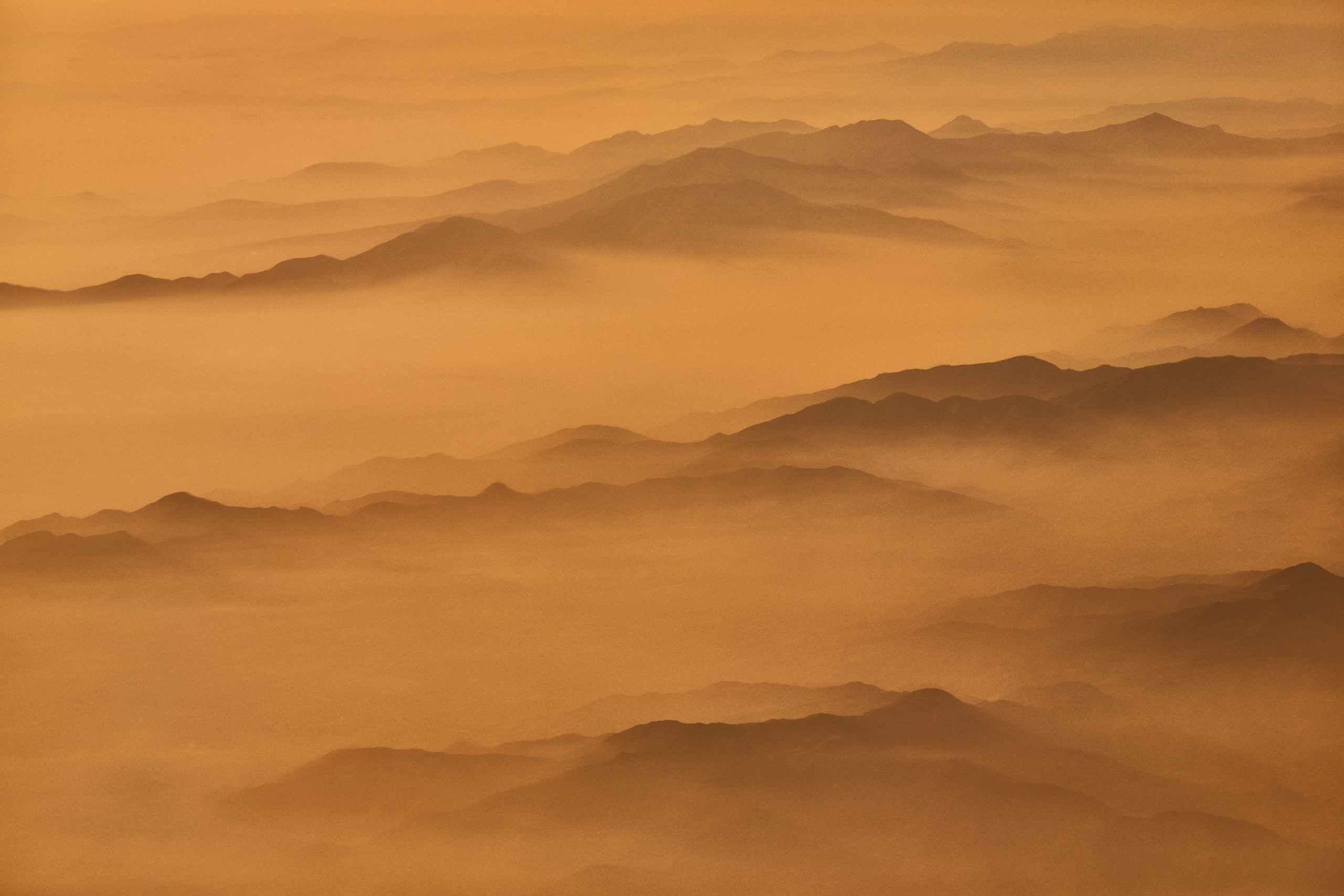 The Andes fading into misty sunset